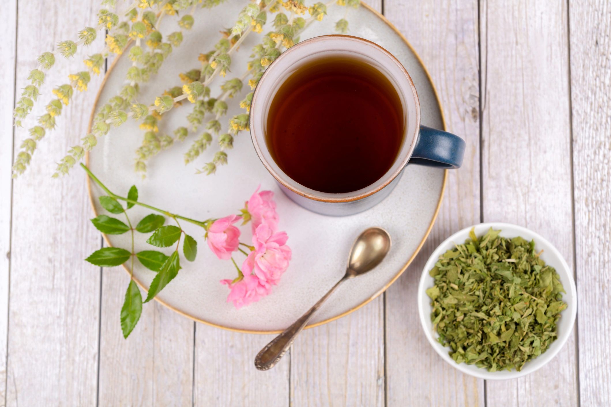 Herbal tea with dried herbs and cup