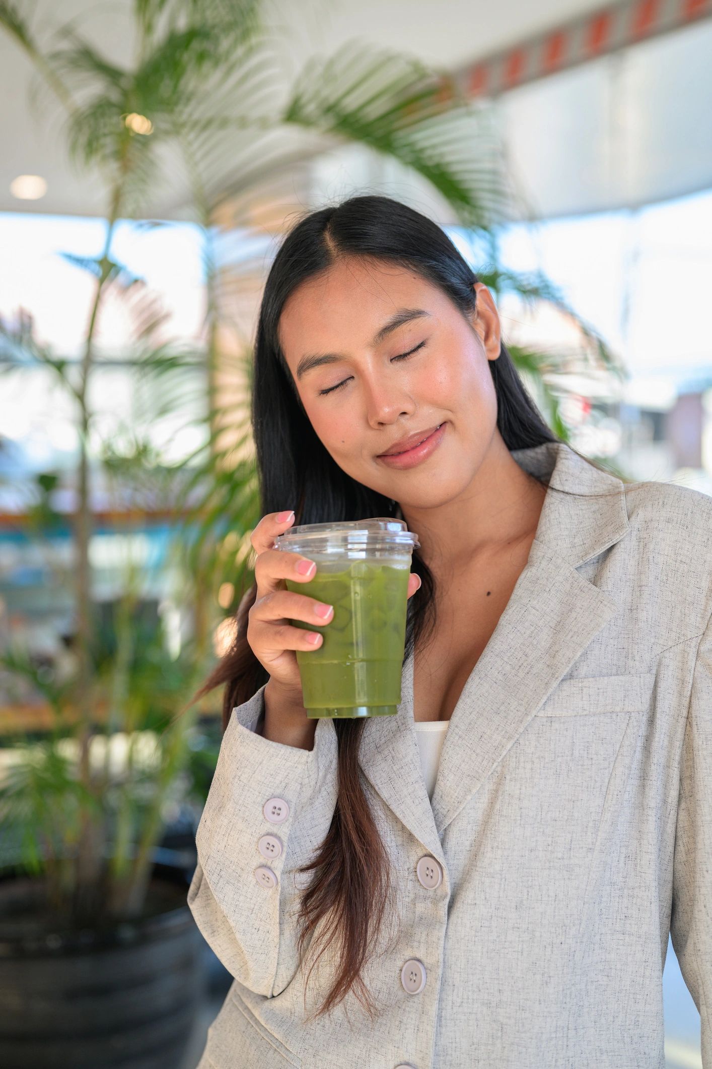 Customer holding a healthy tea beverage